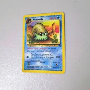 Pokemon Omanyte Card with Yellow and Blue Design